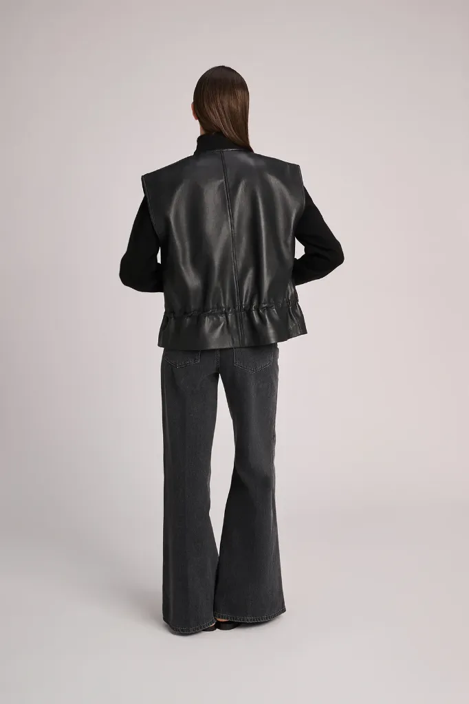 vest_antwerp_black_leather_Pull_anna_black_trousers_mumbai_darkgrey_march23_2.webp